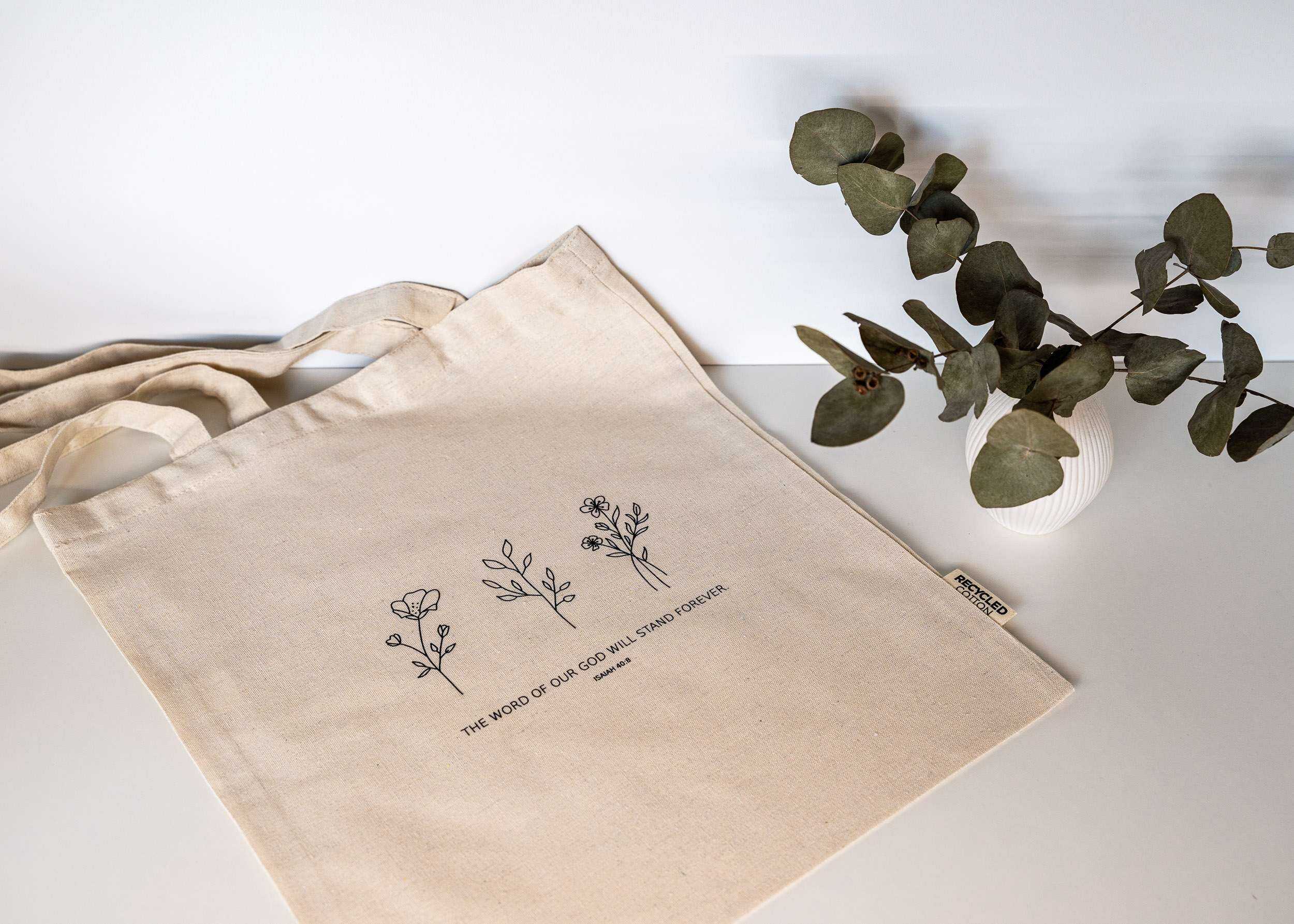 Naturstoff Einkaufstasche mit Bibelvers, nachhaltige christliche Produkte, ökologische Marken.