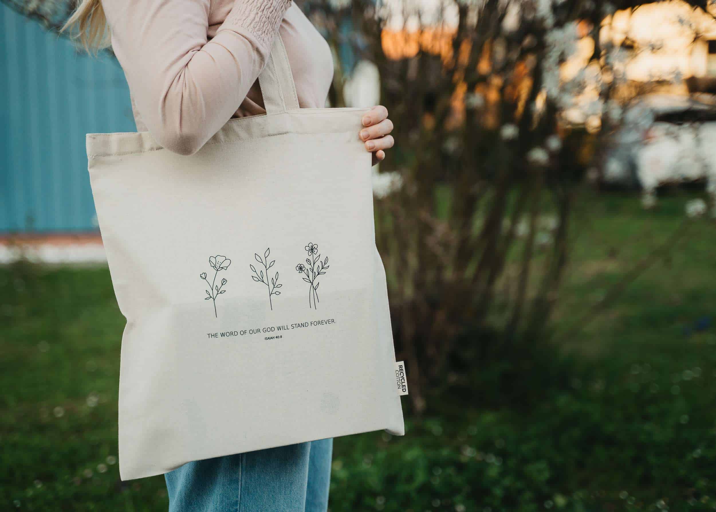 Naturschwarz Baumwolltasche mit christlichem Design, recycelbar, umweltfreundlich.