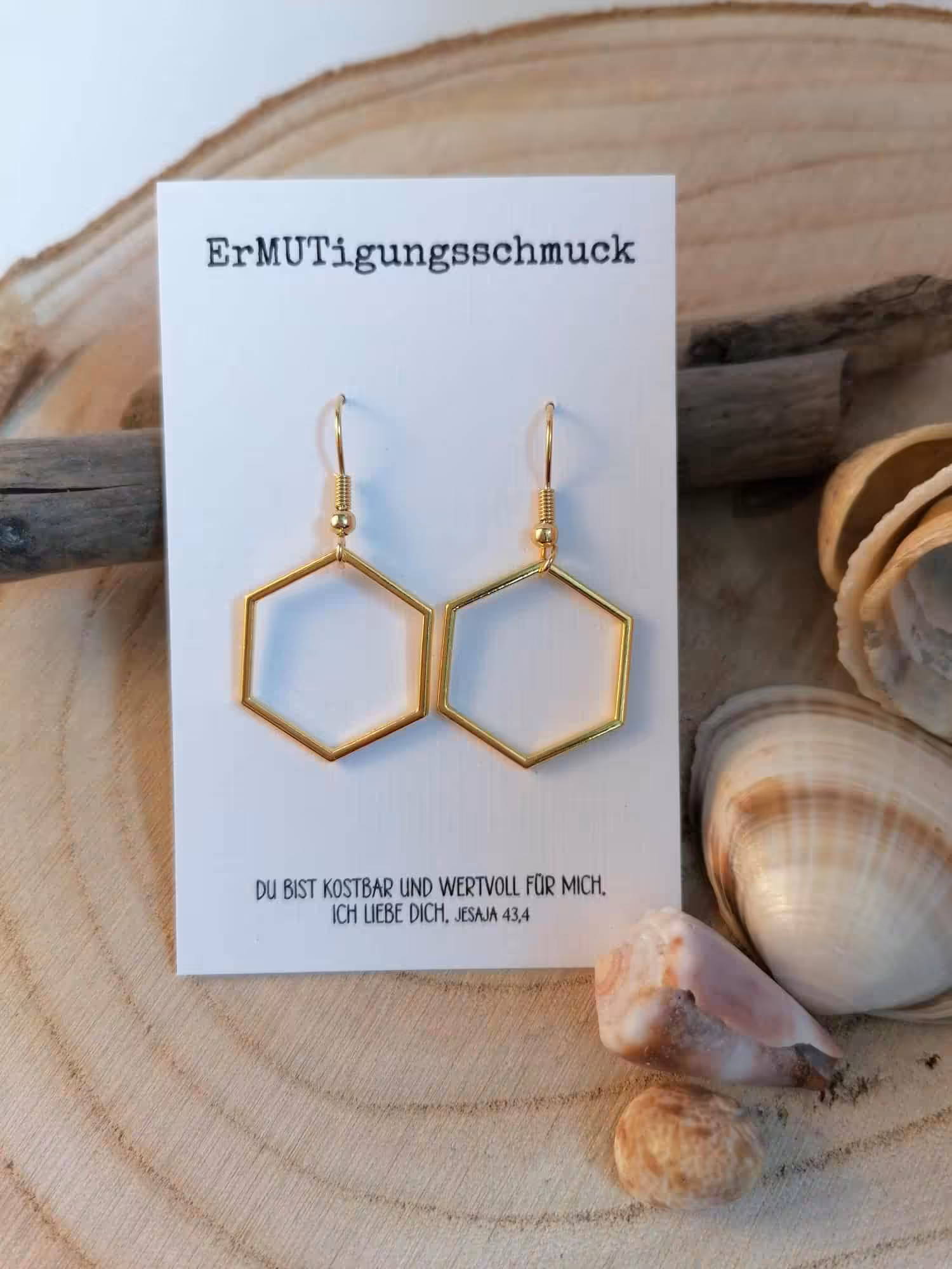 Goldene geometrische Ohrringe auf christlicher Glückwunschkarte, Schmuck für Gläubige.